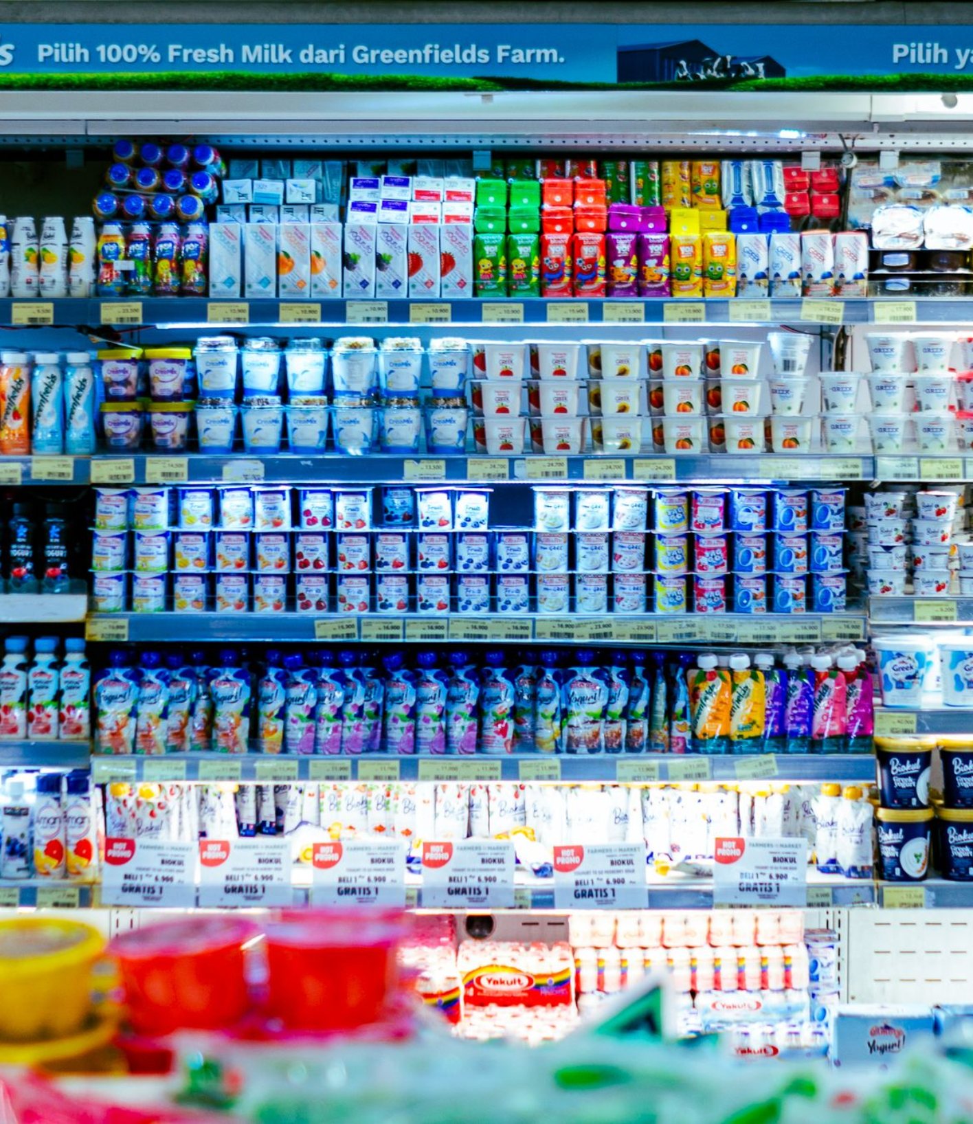 Dairy shelf in a supermarket with a full product range