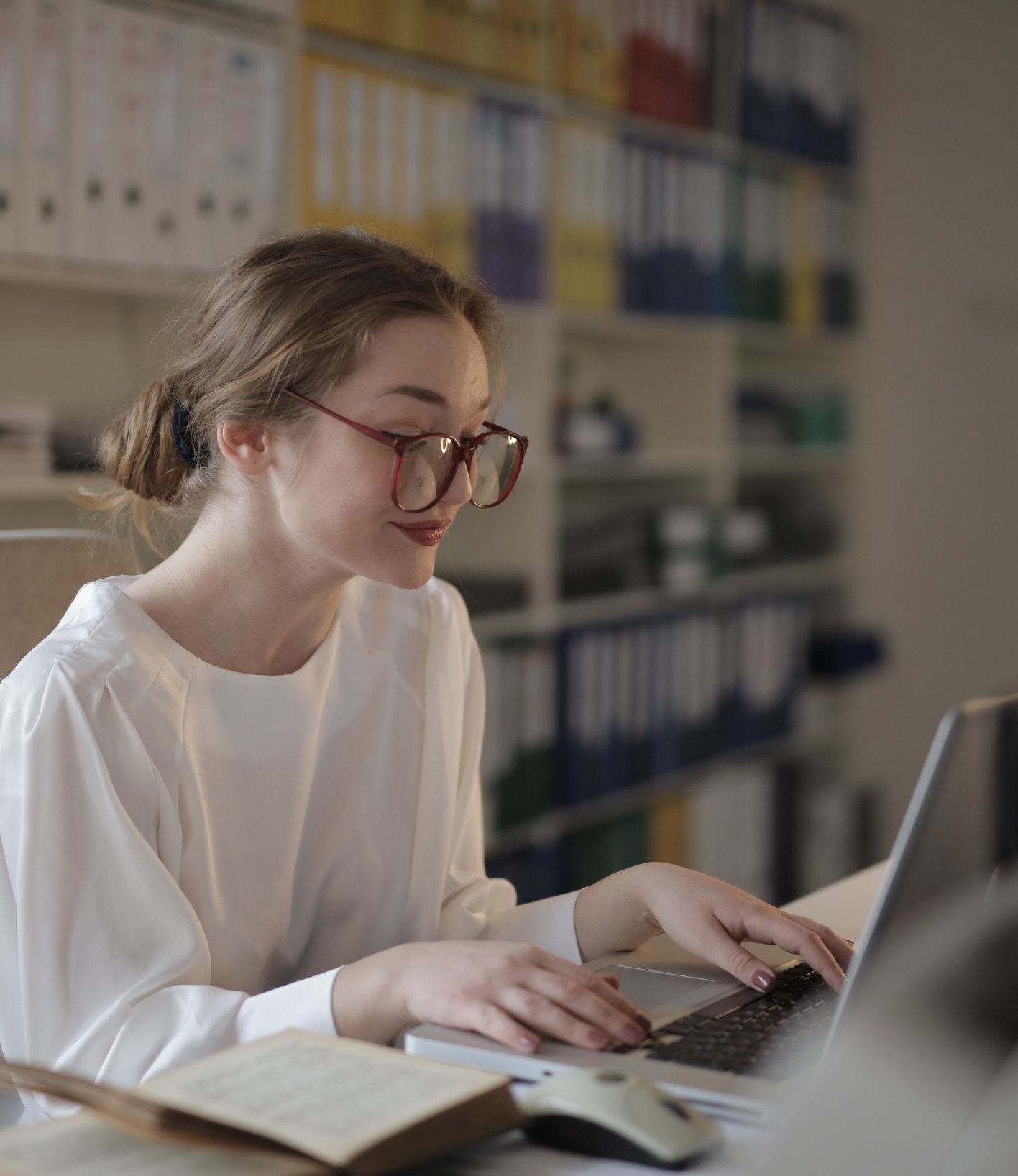 Inventory planner working on a laptop in an office