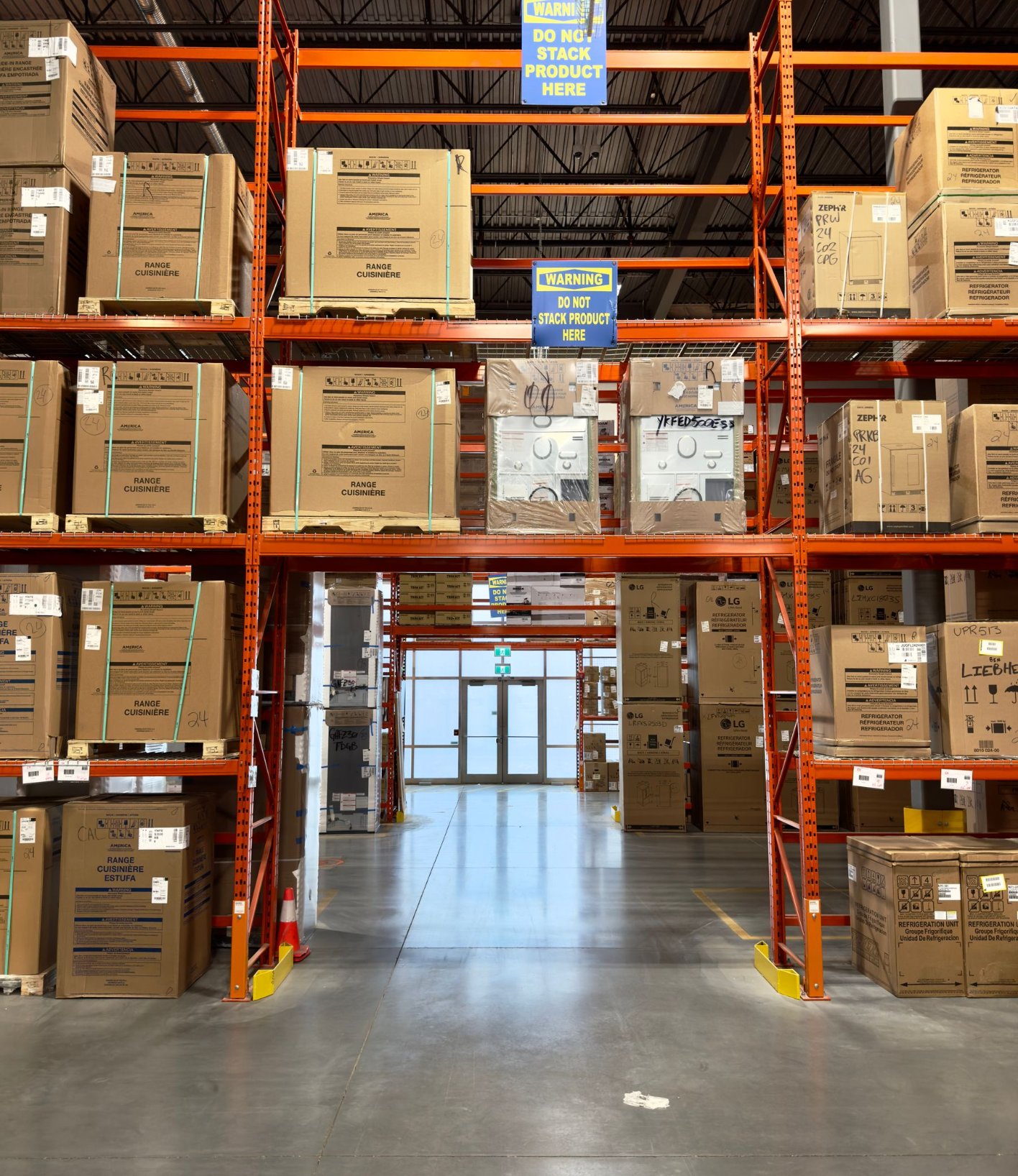 Warehouse aisle with pallet racks full of cartons