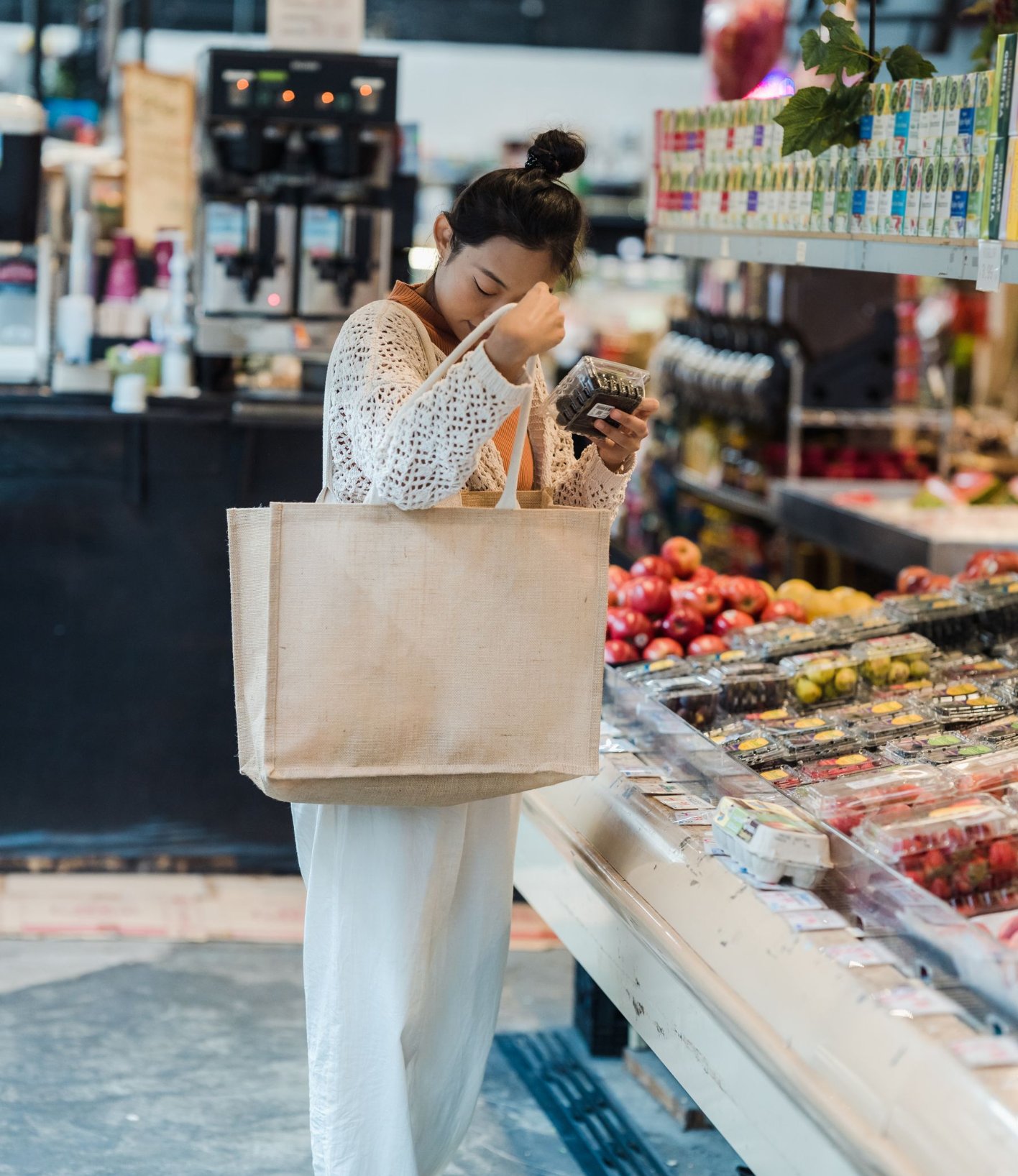 Shopper choosing products at a supermarket counter